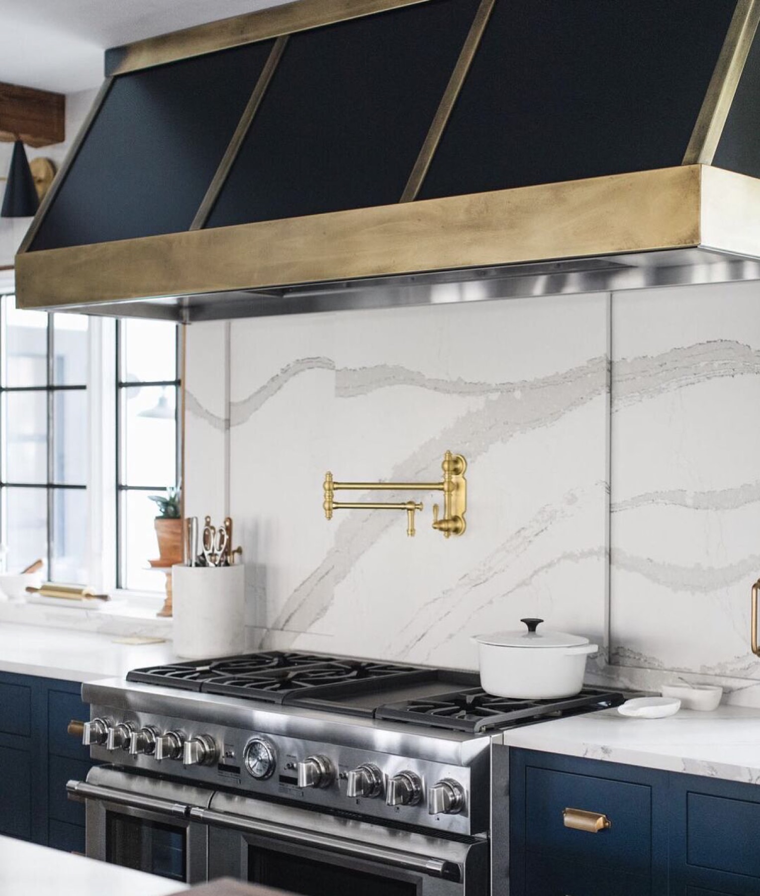 Vent-A-Hood range hood with decorative design accent bands above a kitchen range.